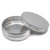 Open aluminum storage can on white background.