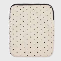 white laptop sleeve with black dots